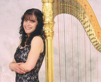 Photo of Pamela Brown with her harp who has provided elegant music for over 20 years.